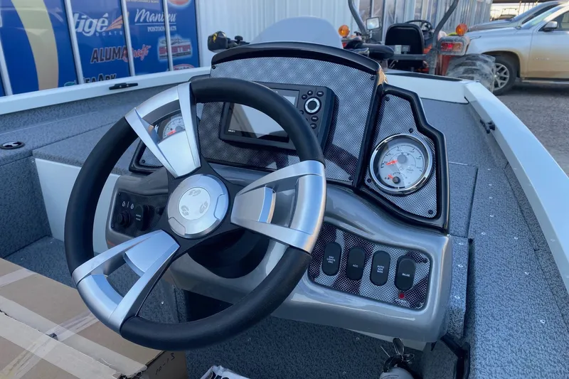 Slide: The Image of Steering console of 2026 G3 Sportsman 1610 boat with modern controls and gauges. - 7
