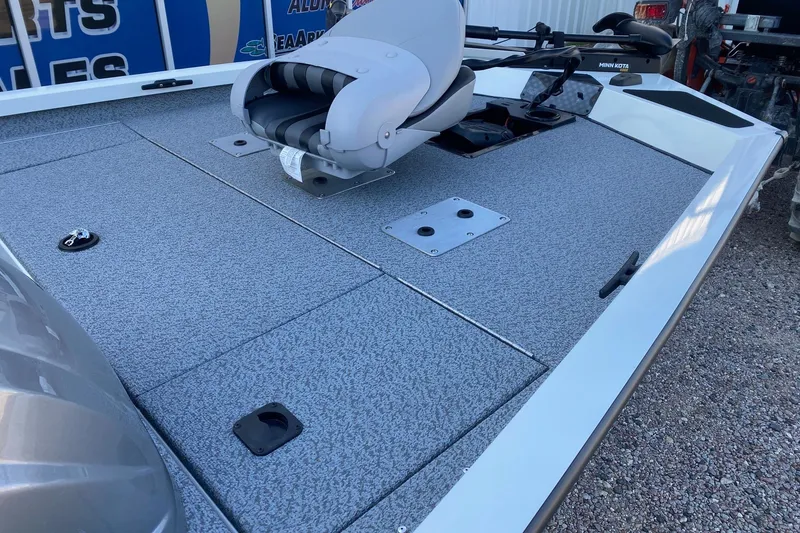 Slide: The Image of 2026 G3 Sportsman 1610 boat deck with seating and storage compartments. - 9