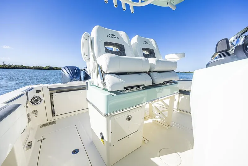 Slide: The Image of 2026 Cobia 265 Center Console boat electrical panel with switches and plug. - 20