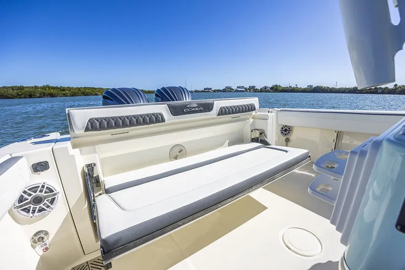 Slide: The Image of 2026 Cobia 265 Center Console boat with Yamaha engines and foldable seating. - 22