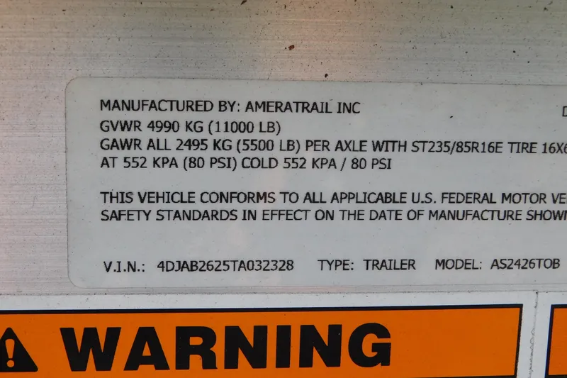 Slide: The Image of 2026 Cobia 265 Center Console boat interior with cushioned seating and sleek design. - 30