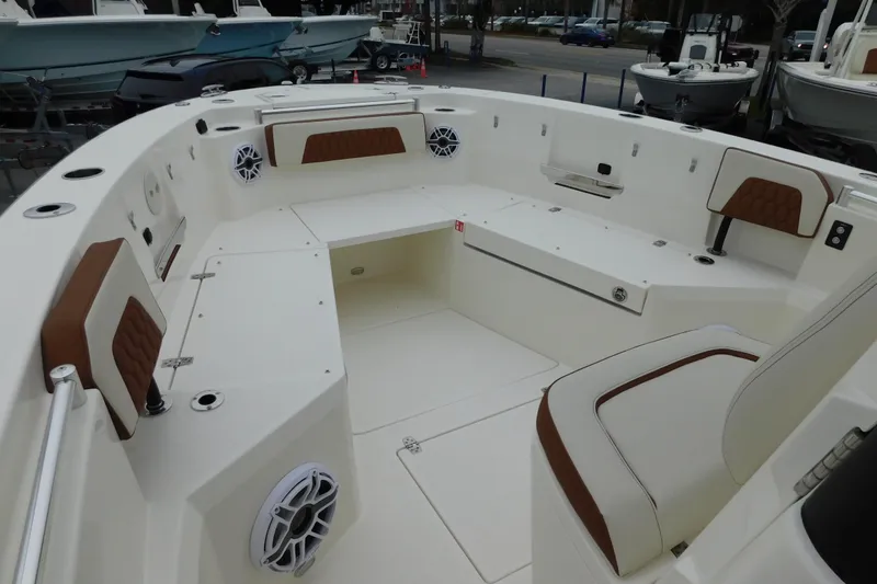 Slide: The Image of 2026 Cobia 265 Center Console boat interior with seating and speakers. - 42