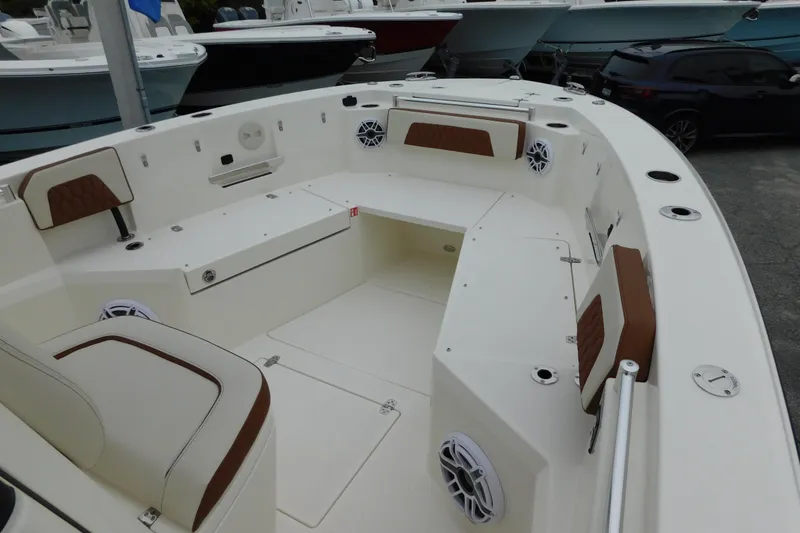 Slide: The Image of 2026 Cobia 265 Center Console boat interior with seating and speakers. - 43
