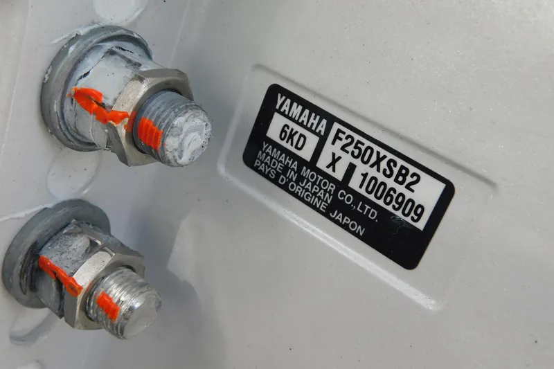 Slide: The Image of Close-up of Yamaha F250XSB2 engine label on 2026 Cobia 265 Center Console. - 48