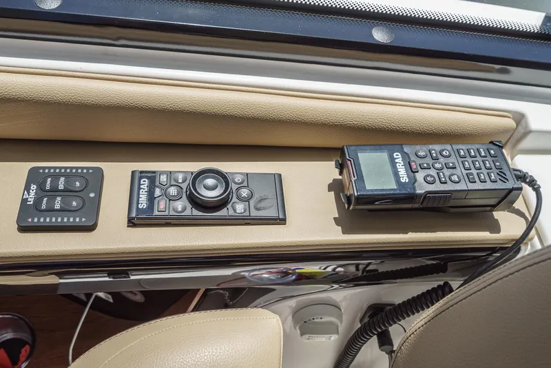 Slide: The Image of Control panel of 2023 Sea Ray Sundancer 370 OB with navigation and communication devices. - 25