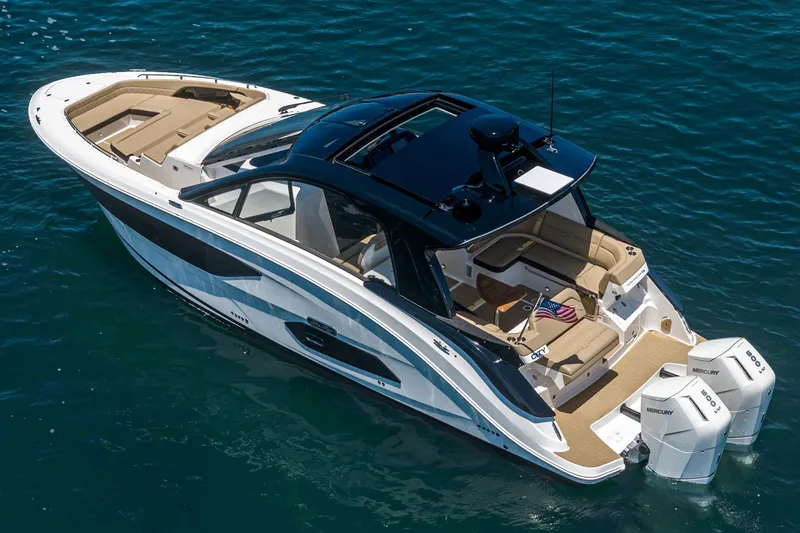 Slide: The Image of 2023 Sea Ray Sundancer 370 OB luxury boat on clear blue water. - 3