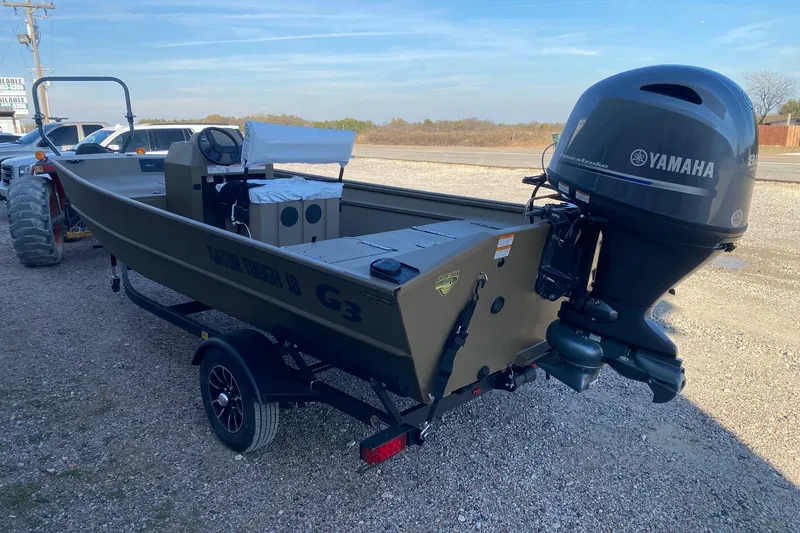Slide: The Image of 2026 G3 Gator Tough 18 CCJ boat with Yamaha outboard motor on trailer. - 4
