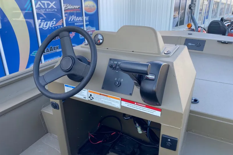 Slide: The Image of 2026 G3 Gator Tough 18 CCJ boat console with steering wheel and controls. - 7