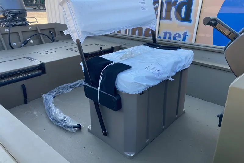 Slide: The Image of 2026 G3 Gator Tough 18 CCJ boat interior with covered seating and control panel. - 8