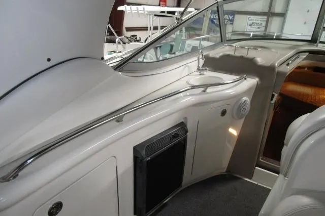 Slide: The Image of 2006 Sea Ray 300 Sundancer interior with sink and seating area. - 10