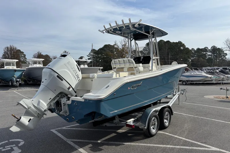 Slide: The Image of 2026 Bulls Bay 230 Center Console boat on trailer, featuring Suzuki outboard motor. - 3