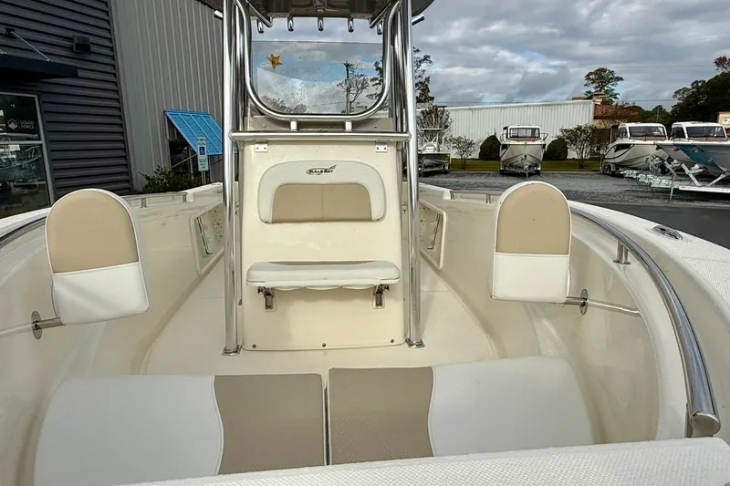 Slide: The Image of 2026 Bulls Bay 230 Center Console boat interior with seating and console view. - 8