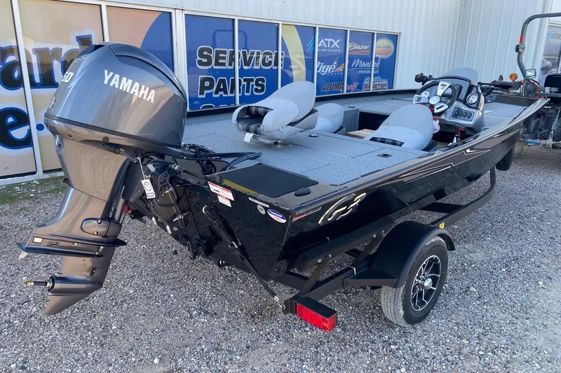 Slide: The Image of 2026 G3 Sportsman 1610 boat with Yamaha outboard motor, parked on gravel. - 6