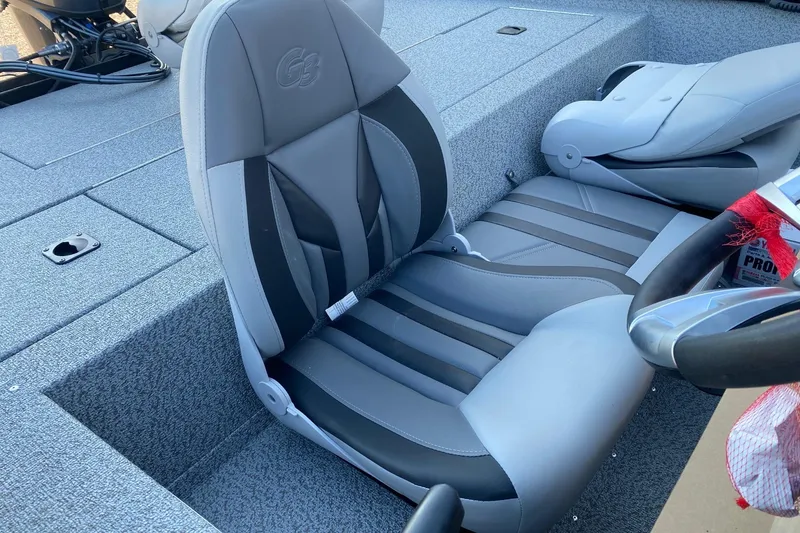 Slide: The Image of 2026 G3 Sportsman 1610 boat interior with gray and black seating. - 8