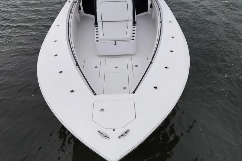 Slide: The Image of 2016 Sea Hunter 35 Tournament boat on water, showcasing spacious deck design. - 18