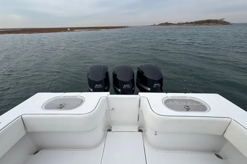 Slide: The Image of 2016 Sea Hunter 35 Tournament boat with triple outboard engines on open water. - 23