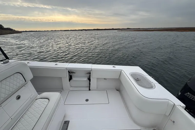 Slide: The Image of 2016 Sea Hunter 35 Tournament boat interior with water view at sunset. - 24