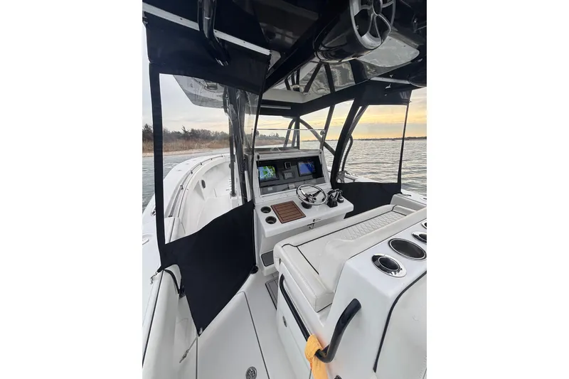 Slide: The Image of 2016 Sea Hunter 35 Tournament boat interior with navigation equipment and seating. - 29