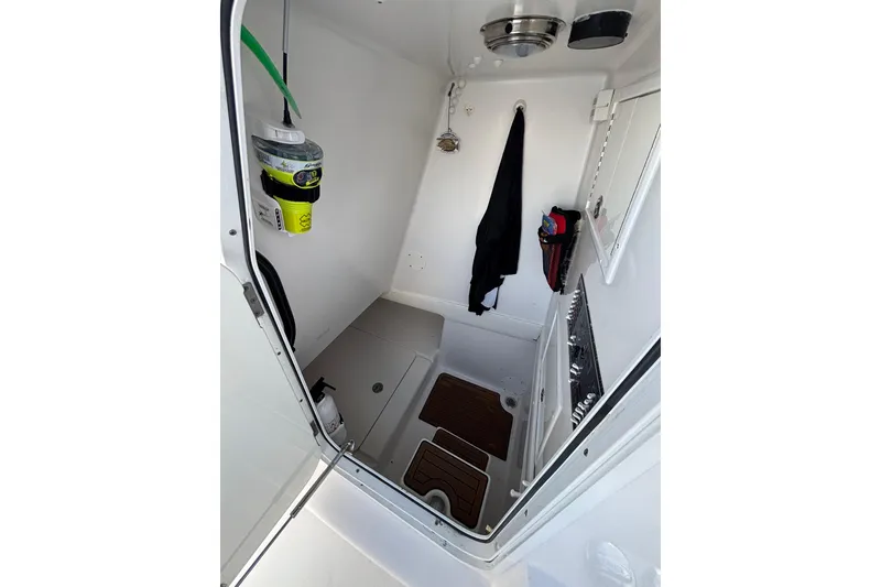Slide: The Image of Interior of 2016 Sea Hunter 35 Tournament boat, featuring storage and safety equipment. - 39