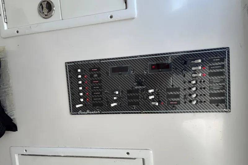 Slide: The Image of Control panel of 2016 Sea Hunter 35 Tournament boat with various switches and indicators. - 40