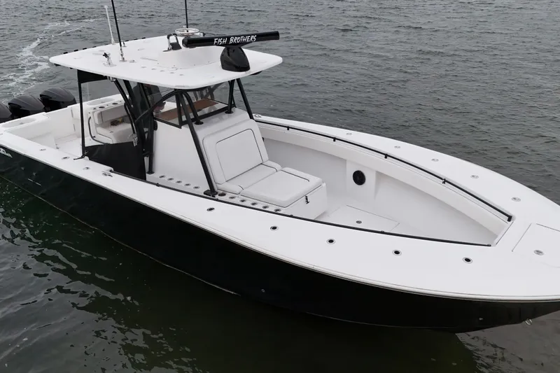 Slide: The Image of 2016 Sea Hunter 35 Tournament boat on water, sleek design, spacious deck. - 6