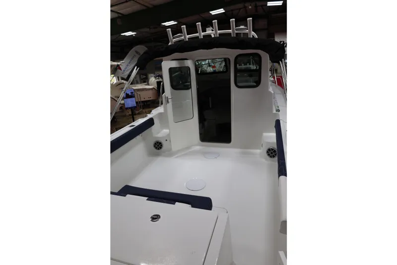 Slide: The Image of 2026 Parker 227 Explorer boat interior with open cabin door, showcasing sleek design. - 4