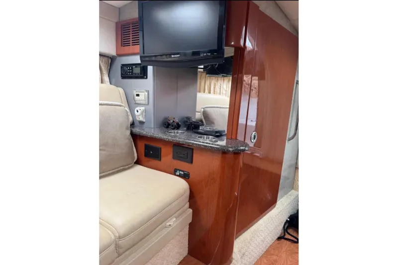 Slide: The Image of Interior of 2010 Formula 310 Sun Sport with TV, seating, and control panel. - 13