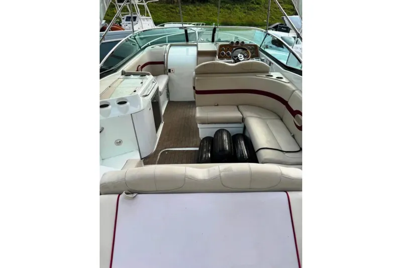 Slide: The Image of 2010 Formula 310 Sun Sport boat interior with seating and dashboard view. - 7