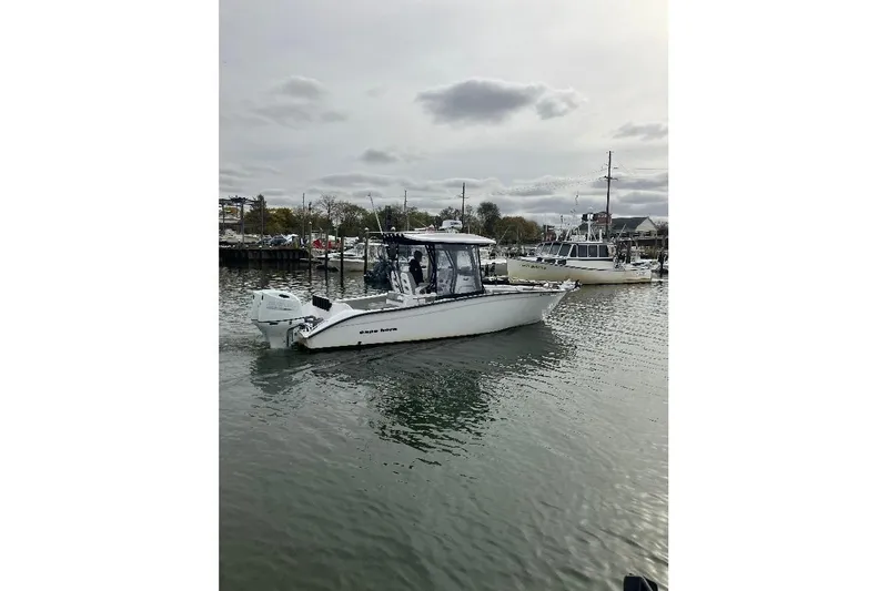 Slide: The Image of 2023 Cape Horn 27 XS boat on calm water, overcast sky background. - 5