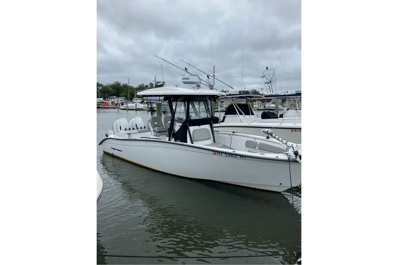 Slide: The Image of 2023 Cape Horn 27 XS boat console with Simrad and Garmin displays. - 9