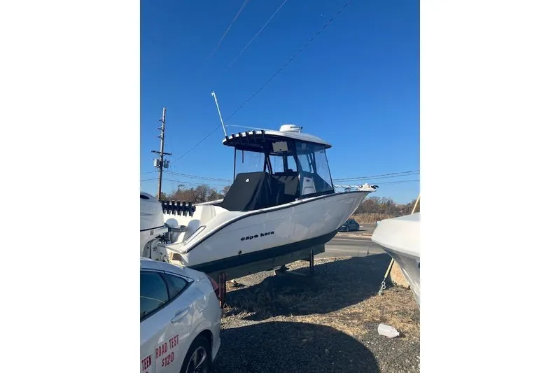 Slide: The Image of 2023 Cape Horn 27 XS boat displayed outdoors under clear blue sky. - 3