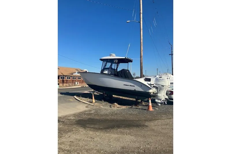 Slide: The Image of 2023 Cape Horn 27 XS boat on display with dual engines. - 4