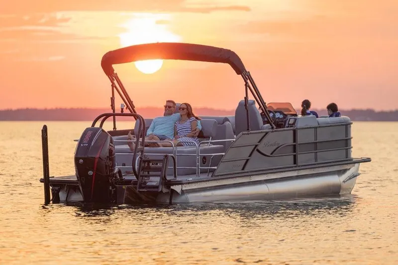 Slide: The Image of 2026 Bentley Pontoons Legacy 223 Navigator, sleek design with black canopy. - 2