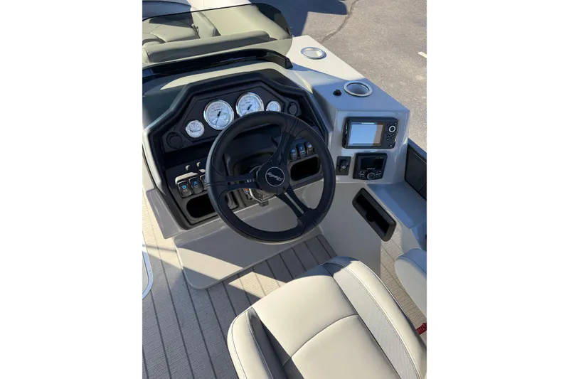 Slide: The Image of 2026 Bentley Pontoons Legacy 223 Navigator dashboard with steering wheel and control panel. - 6