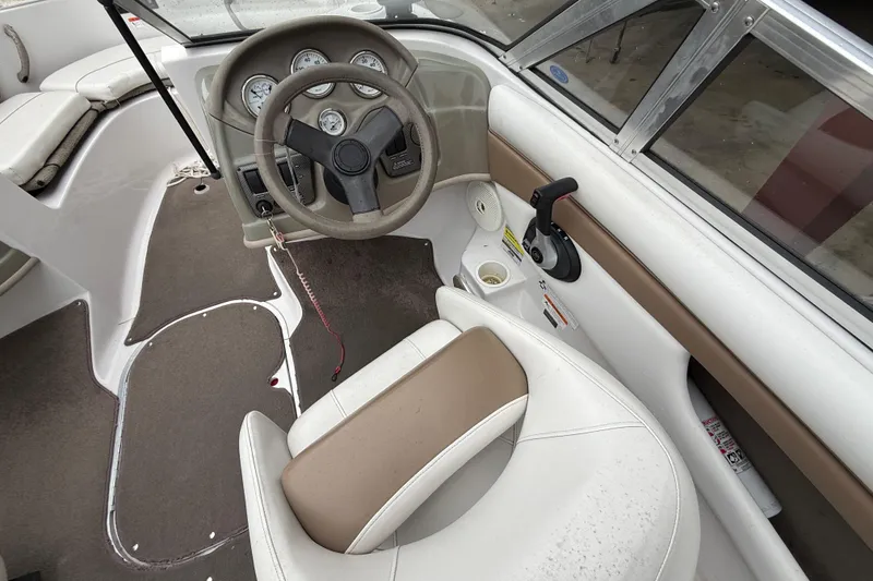 Slide: The Image of 2008 Four Winns 203 Horizon Fish & Ski boat interior with steering wheel and controls. - 5