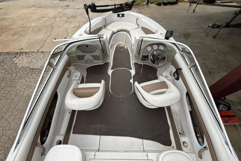 Slide: The Image of 2008 Four Winns 203 Horizon Fish & Ski boat interior with seating and dashboard. - 6