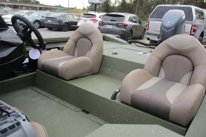 Slide: The Image of 2026 Vexus DEFENDER AVX181 boat interior with dual seats and steering wheel. - 17