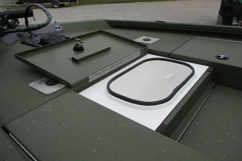 Slide: The Image of 2026 Vexus DEFENDER AVX181 boat with open storage compartment on deck. - 19