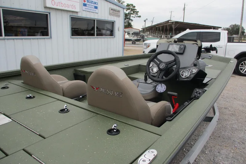 Slide: The Image of 2026 Vexus DEFENDER AVX181 boat interior with dual seats and control panel. - 10
