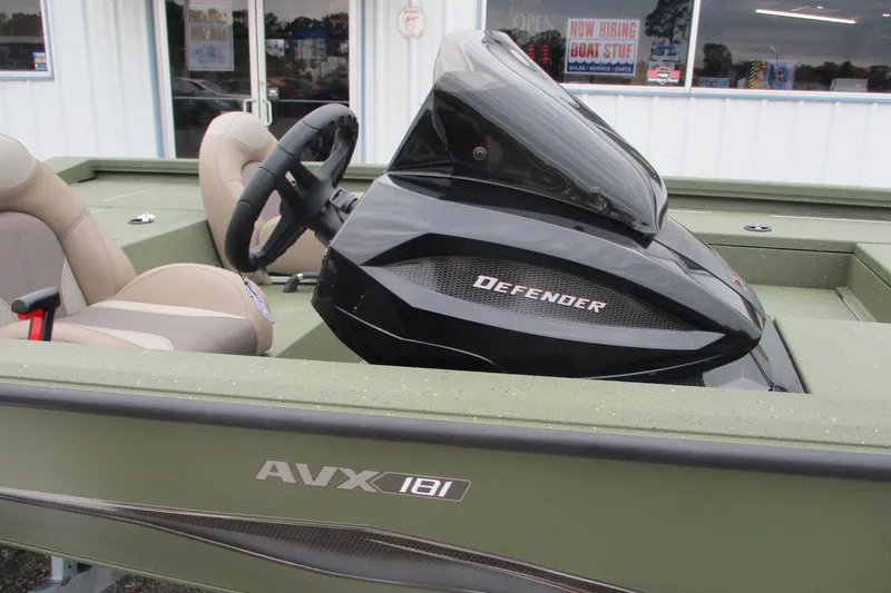 Slide: The Image of 2026 Vexus DEFENDER AVX181 boat interior with steering wheel and seats. - 13