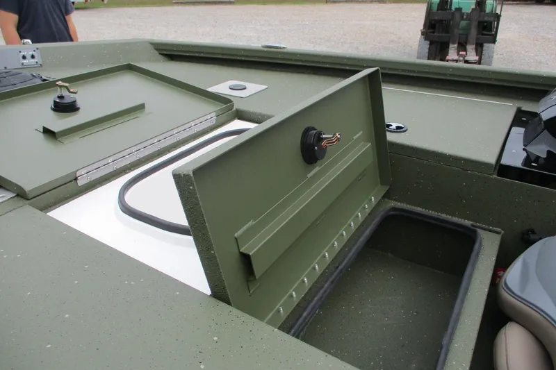 Slide: The Image of 2026 Vexus DEFENDER AVX181 boat storage compartment with open lid, showcasing interior details. - 20