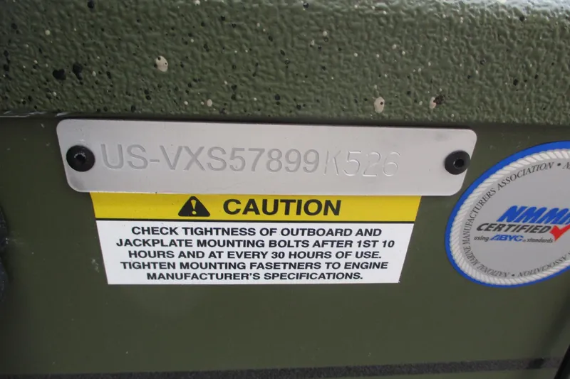 Slide: The Image of 2026 Vexus DEFENDER AVX181 caution label with maintenance instructions and certification sticker. - 21