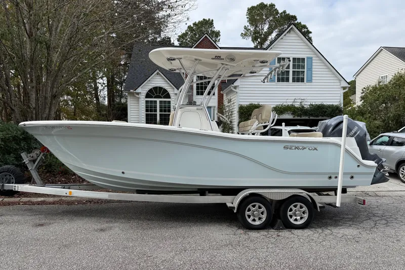 The Image of 2017 Sea Fox 226 Commander boat on trailer in residential area. - 0