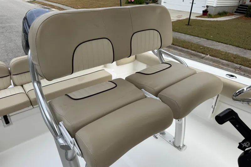 Slide: The Image of 2017 Sea Fox 226 Commander boat with beige cushioned seating and stainless steel frame. - 13