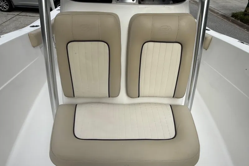 Slide: The Image of 2017 Sea Fox 226 Commander boat seating with beige and white upholstery. - 18