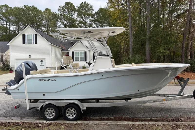 Slide: The Image of 2017 Sea Fox 226 Commander boat on trailer in residential driveway. - 2