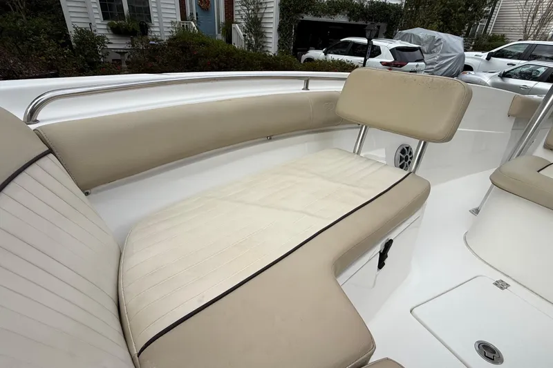 Slide: The Image of 2017 Sea Fox 226 Commander boat interior with beige seating and stainless steel rail. - 20