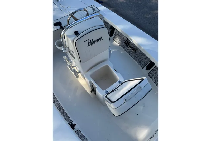 Slide: The Image of 2019 Maverick 18 HPX-V boat cruising on a serene lake under clear blue skies. - 13