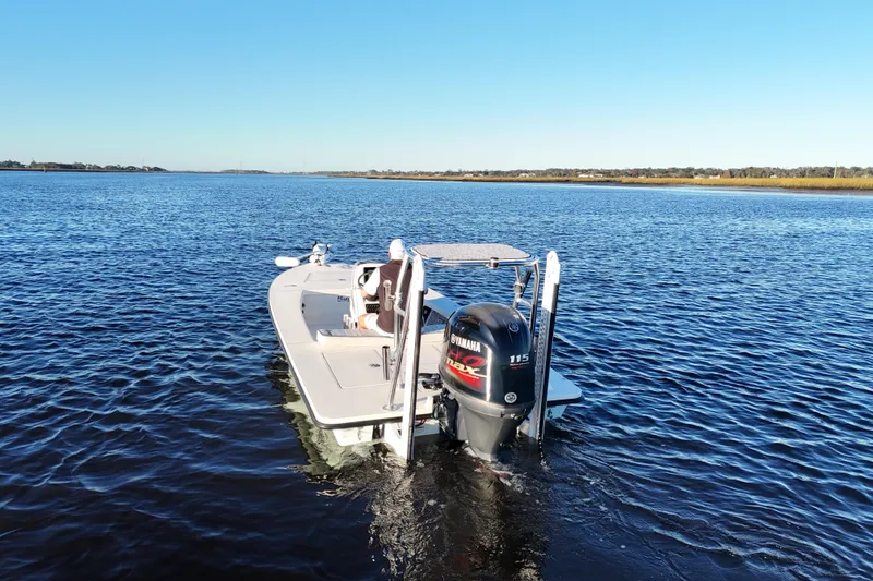 Slide: The Image of 2019 Maverick 18 HPX-V boat on calm water with Yamaha outboard motor. - 29