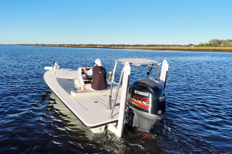 Slide: The Image of 2019 Maverick 18 HPX-V boat on water with Yamaha engine, clear blue sky. - 30